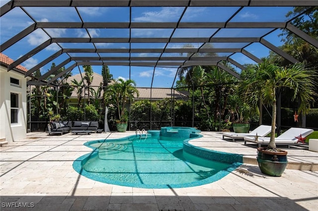 view of swimming pool with a patio area, outdoor lounge area, and glass enclosure