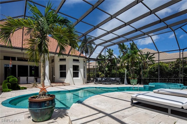 view of swimming pool featuring glass enclosure, a jacuzzi, outdoor lounge area, and a patio