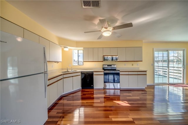 kitchen with sink, ceiling fan, stainless steel appliances, light hardwood / wood-style floors, and white cabinets