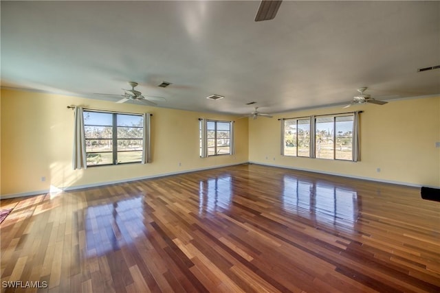 spare room with hardwood / wood-style flooring