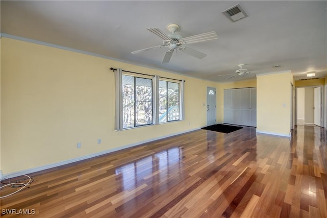 unfurnished living room with hardwood / wood-style flooring and ceiling fan