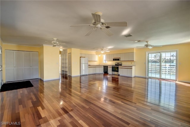 unfurnished living room with hardwood / wood-style flooring