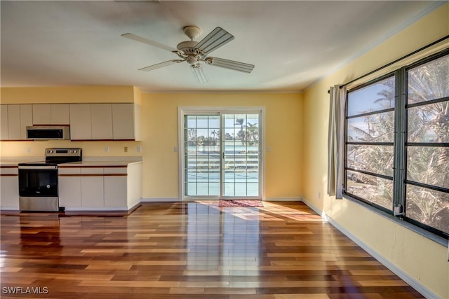 kitchen with ceiling fan, light wood-type flooring, white cabinets, and stainless steel electric range oven