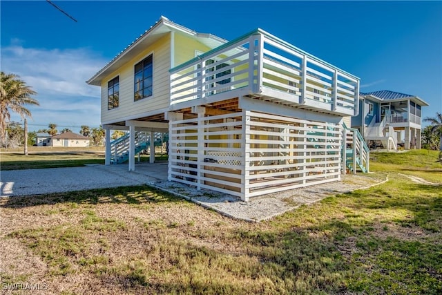 rear view of house with a yard