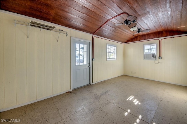 garage featuring cooling unit, wood ceiling, and ceiling fan