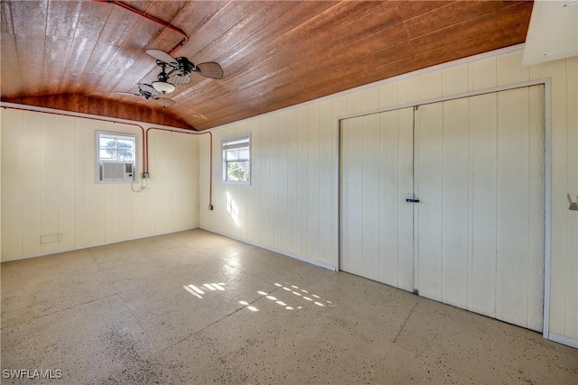 unfurnished bedroom featuring lofted ceiling, wood ceiling, a closet, cooling unit, and ceiling fan