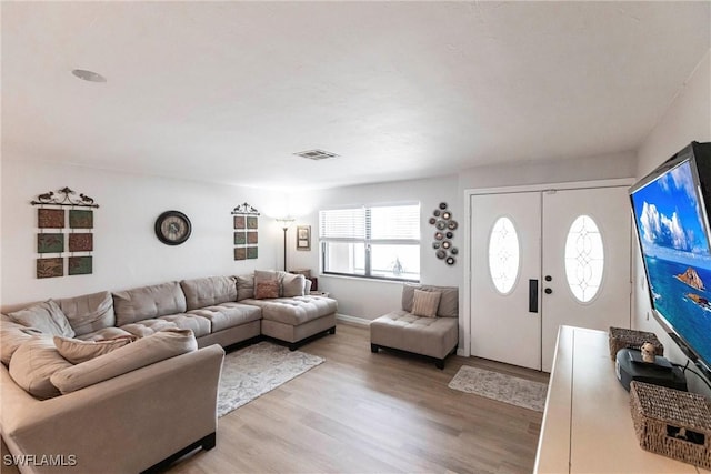 living room featuring light wood-type flooring