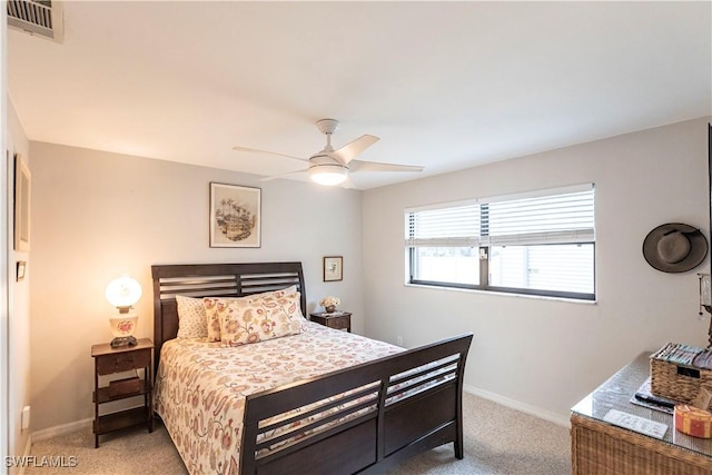 bedroom featuring ceiling fan and light carpet