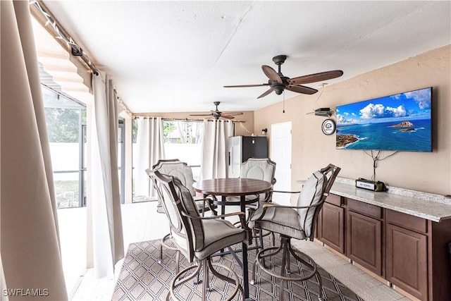 dining room featuring ceiling fan