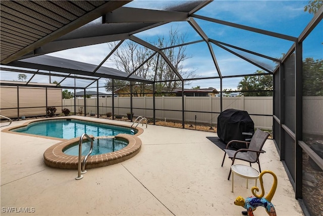 view of swimming pool featuring glass enclosure, a grill, an in ground hot tub, and a patio