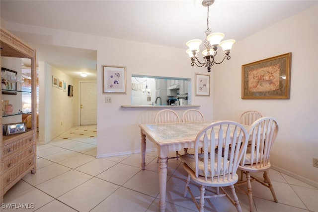 dining room featuring an inviting chandelier and light tile patterned floors