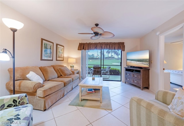 living room with light tile patterned floors and ceiling fan