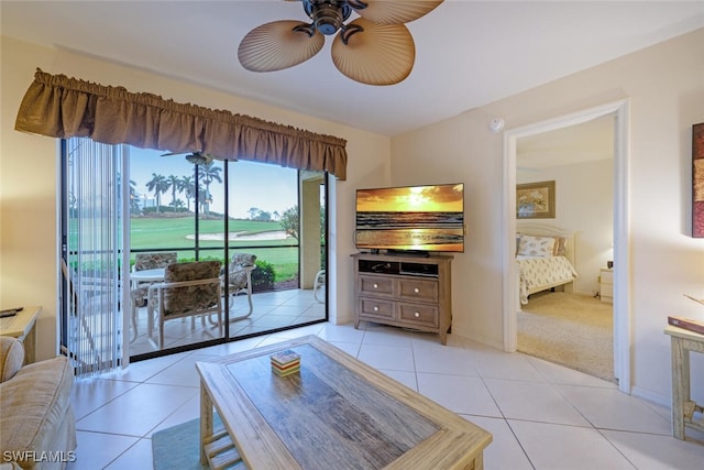 living room featuring light tile patterned floors and ceiling fan