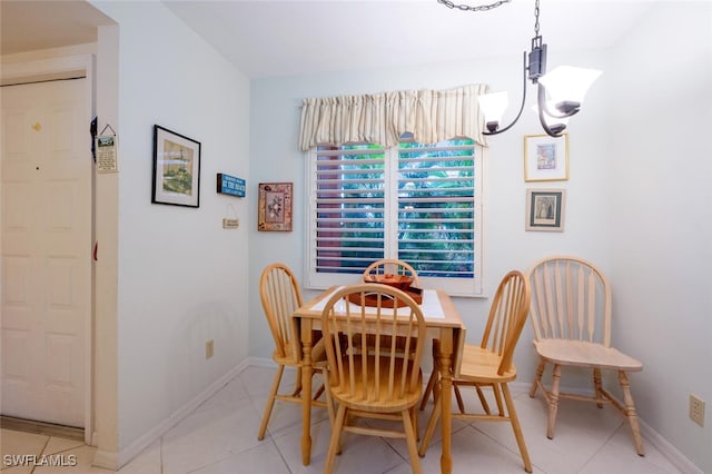 dining room featuring a notable chandelier and light tile patterned floors