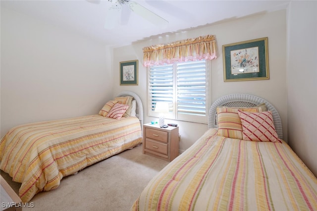 bedroom with light carpet and ceiling fan