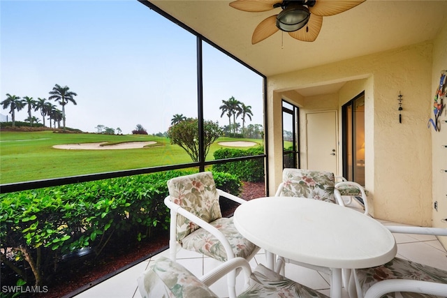 sunroom with ceiling fan