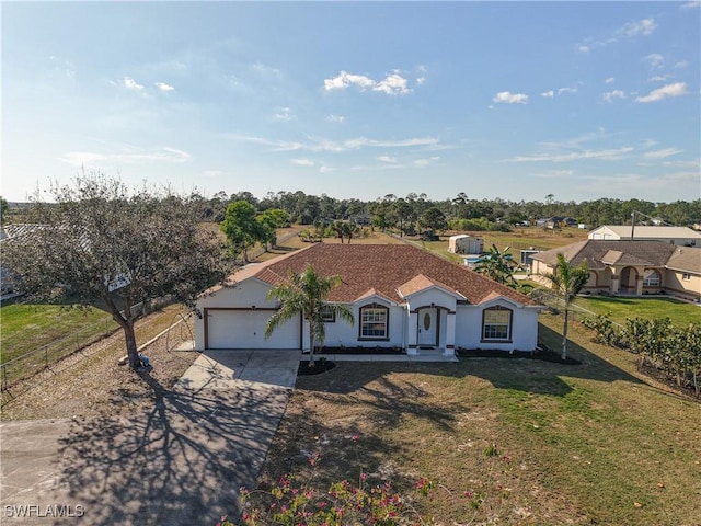 view of front of property with a garage and a front yard