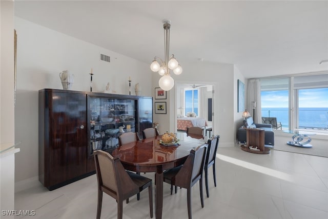 dining space featuring baseboards and visible vents