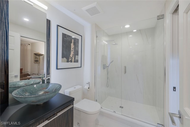 full bathroom featuring a marble finish shower, visible vents, toilet, vanity, and recessed lighting