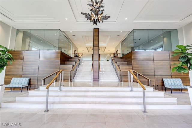 stairway with recessed lighting, a raised ceiling, and tile patterned flooring