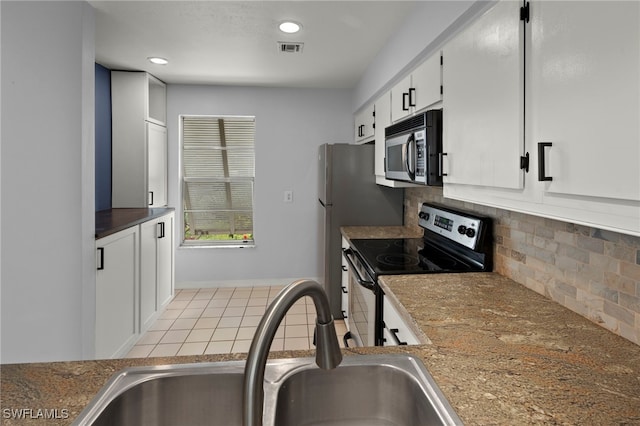 kitchen with tasteful backsplash, sink, stainless steel appliances, and white cabinets