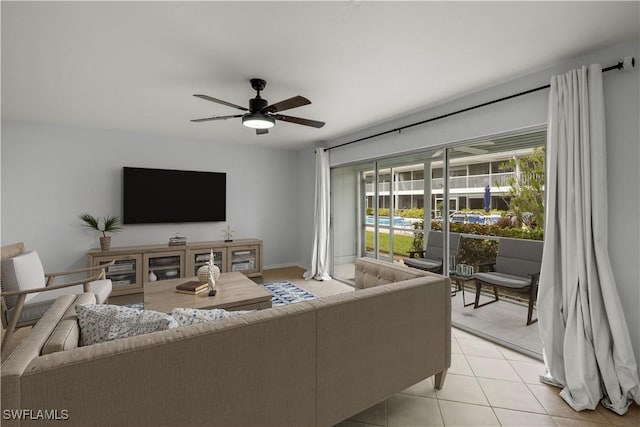 tiled living room featuring ceiling fan