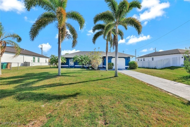 single story home with a front yard, cooling unit, and a garage