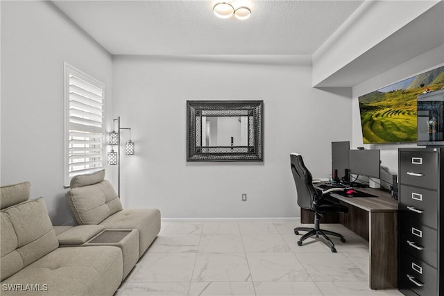 home office featuring a textured ceiling