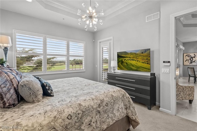 bedroom featuring light colored carpet, a notable chandelier, a tray ceiling, and ornamental molding