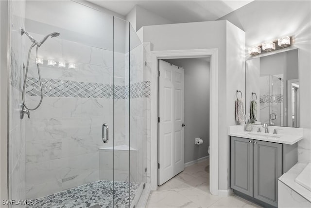 bathroom with walk in shower, vanity, and toilet