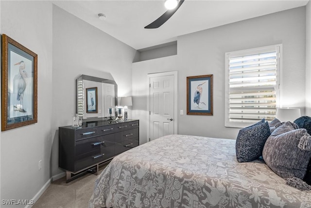 bedroom with ceiling fan and light colored carpet