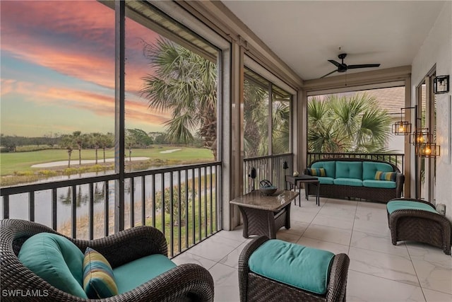 sunroom / solarium featuring ceiling fan