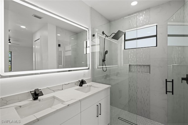 bathroom with an enclosed shower and vanity