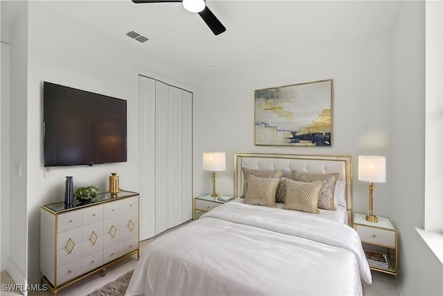 bedroom featuring ceiling fan and a closet