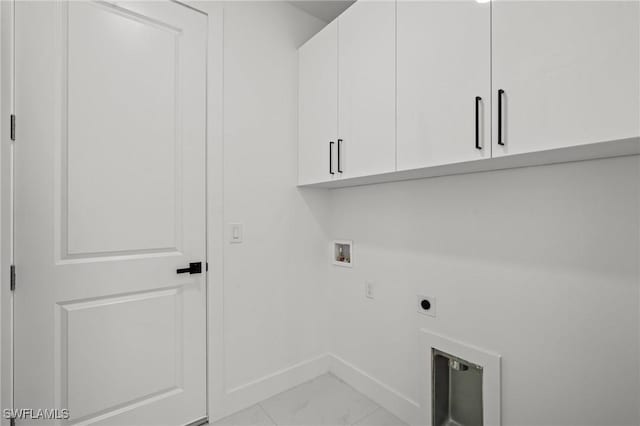 laundry area featuring cabinets, hookup for a washing machine, and electric dryer hookup