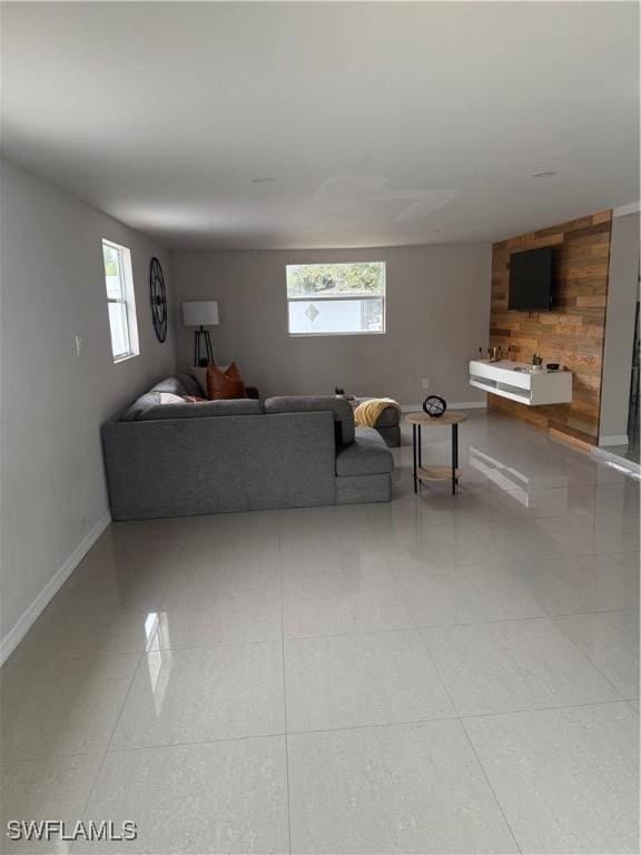 living room featuring wood walls