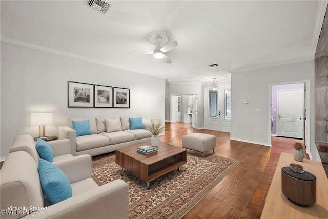 living room with ceiling fan, crown molding, and hardwood / wood-style floors