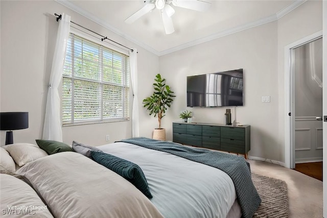 bedroom featuring ceiling fan, carpet, and ornamental molding