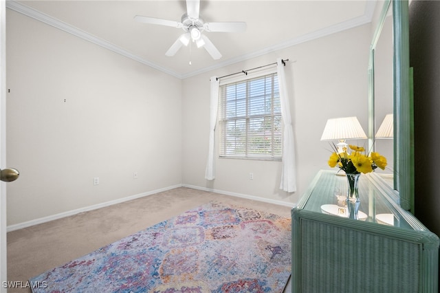 interior space featuring ceiling fan, ornamental molding, and carpet flooring