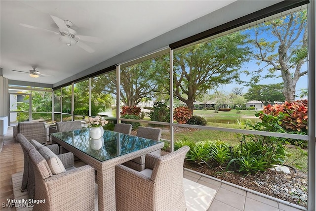 sunroom featuring ceiling fan