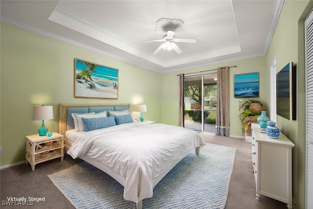 bedroom featuring dark carpet, ceiling fan, a tray ceiling, access to exterior, and crown molding