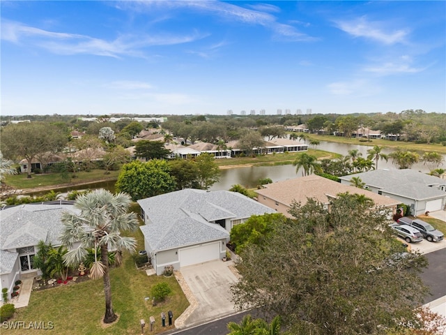 birds eye view of property with a water view