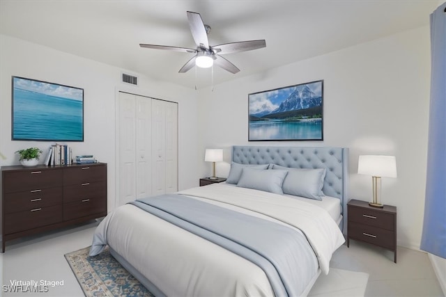 bedroom with ceiling fan and a closet