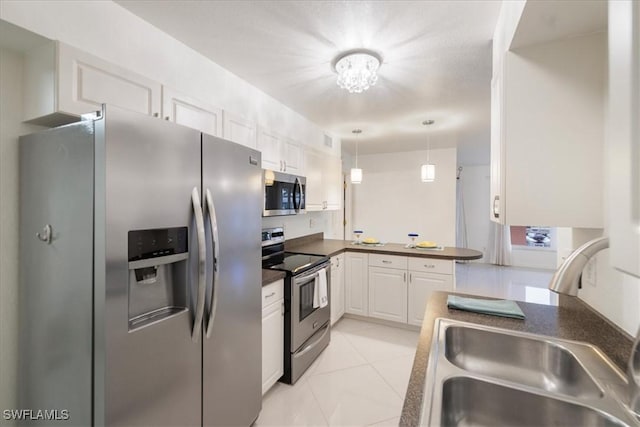 kitchen with decorative light fixtures, light tile patterned flooring, sink, white cabinetry, and stainless steel appliances