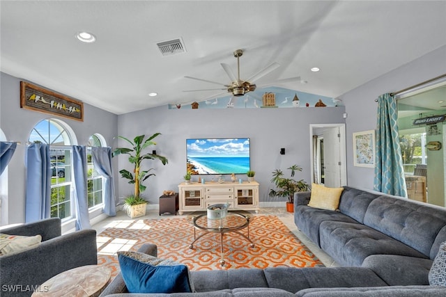 living room featuring ceiling fan and vaulted ceiling