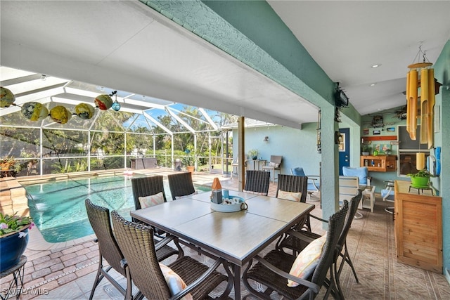 view of patio / terrace with a lanai