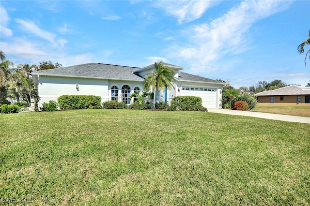 view of front of house featuring a garage and a front yard