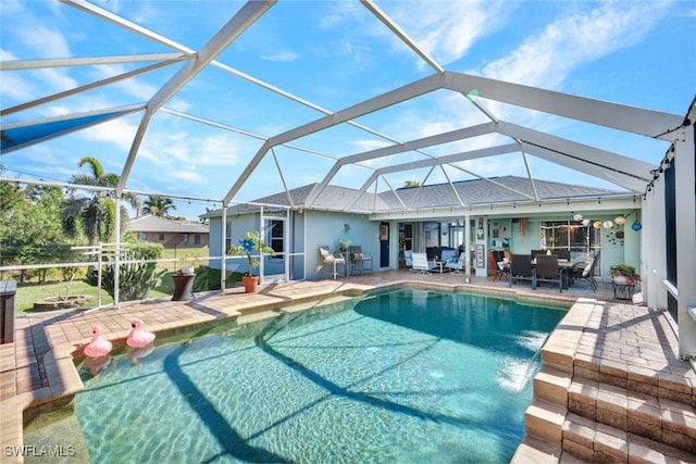 view of pool with a lanai and a patio