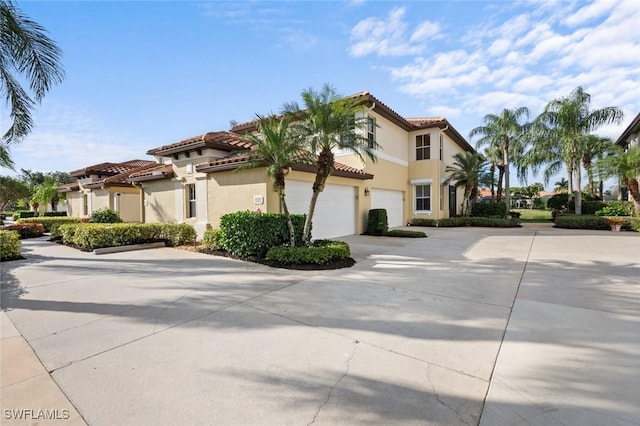 mediterranean / spanish-style house featuring a garage