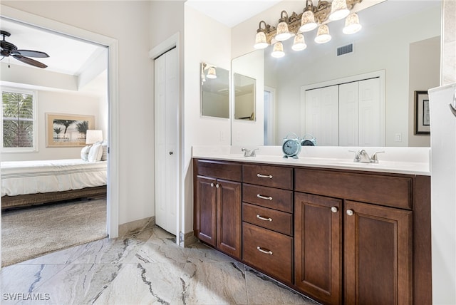 bathroom with ceiling fan and vanity